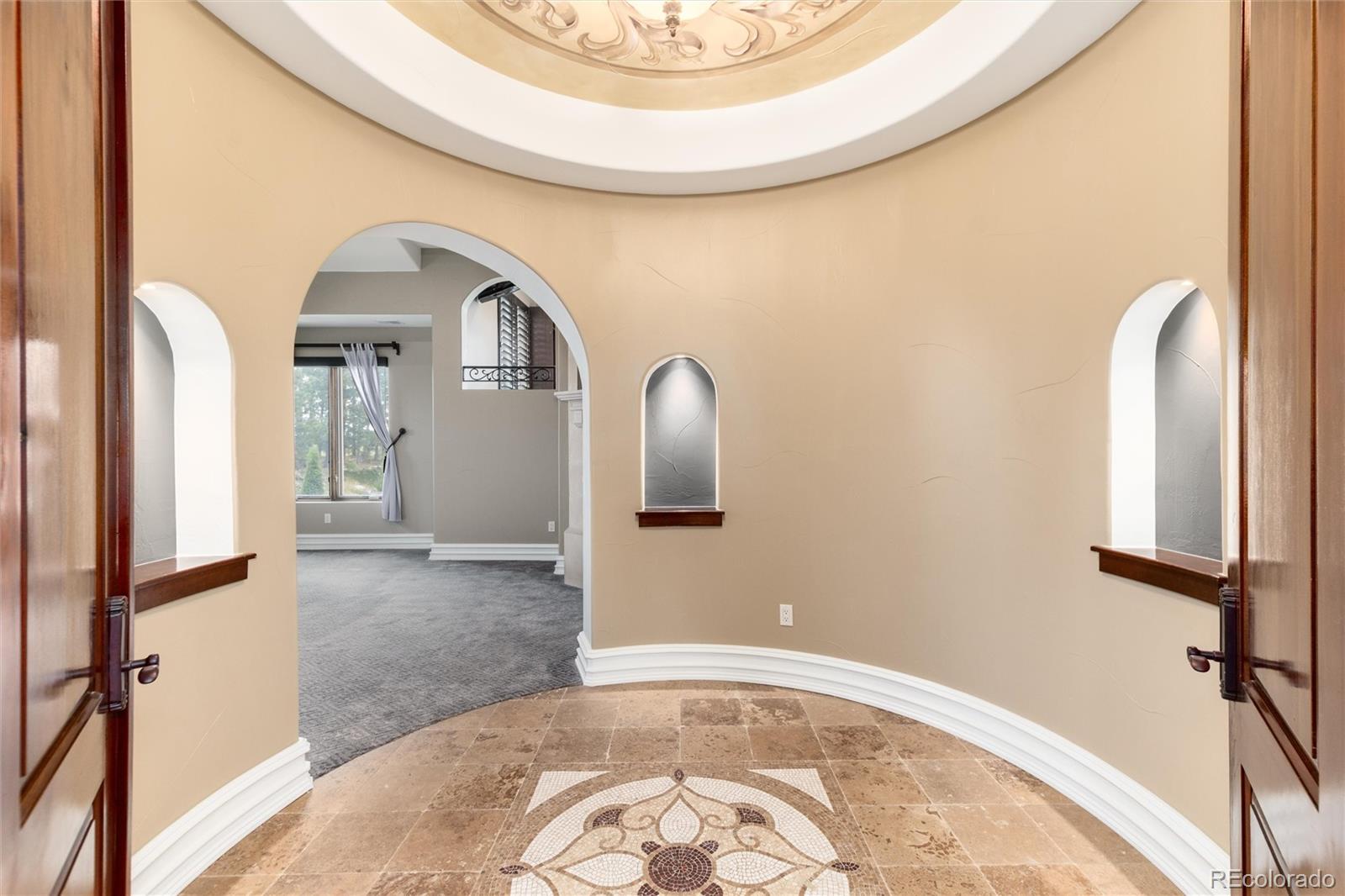 8417 High Ridge Court Castle Pines, CO 80108 - Photo 26 of 48 a view of a livingroom with wooden floor and a bathroom