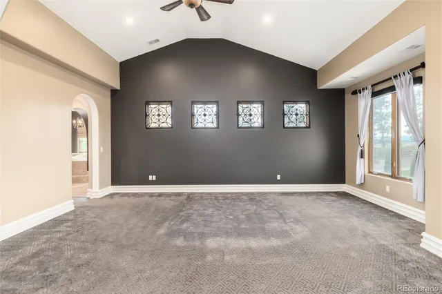 a spacious bathroom with a sink a mirror and bathtub