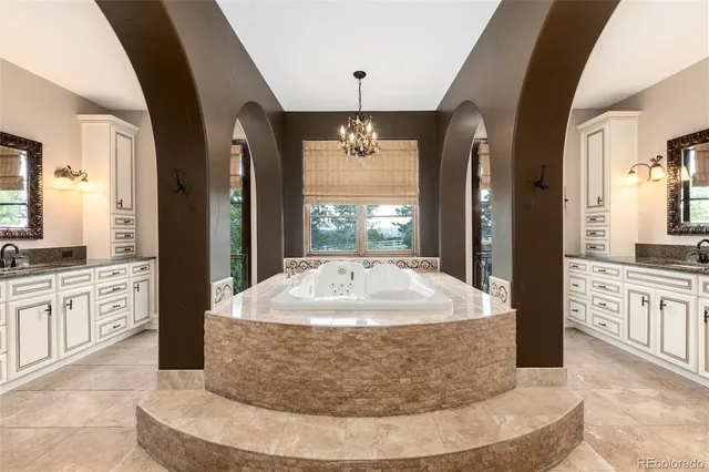 a bathroom with a granite countertop sink toilet mirror and shower