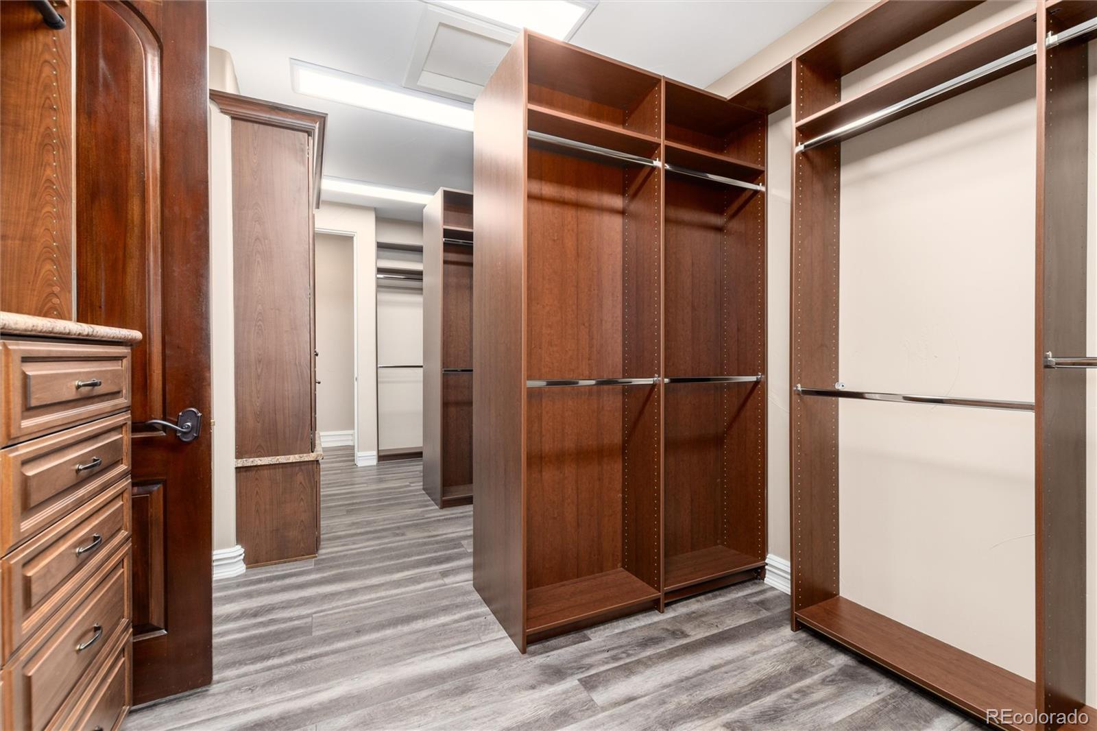 8417 High Ridge Court Castle Pines, CO 80108 - Photo 30 of 48 a view of closet area with hardwood floor