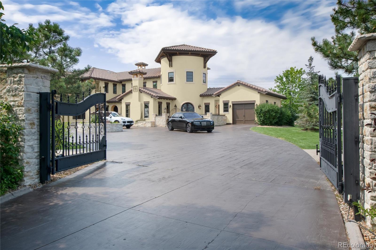 8417 High Ridge Court Castle Pines, CO 80108 - Photo 3 of 48 a front view of a house with a yard
