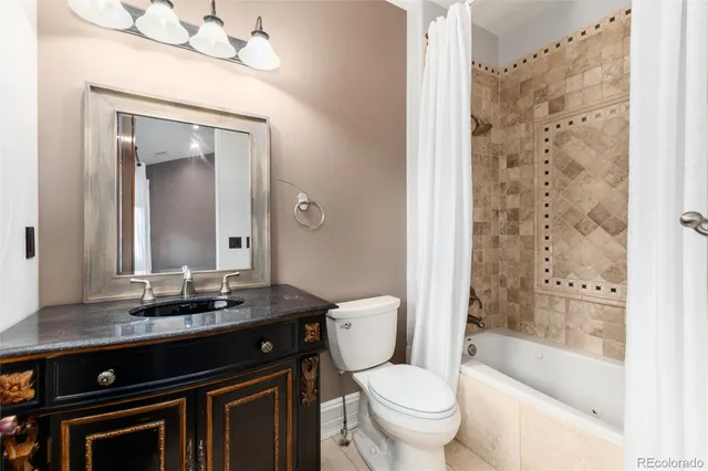 a bedroom with a bed and large windows