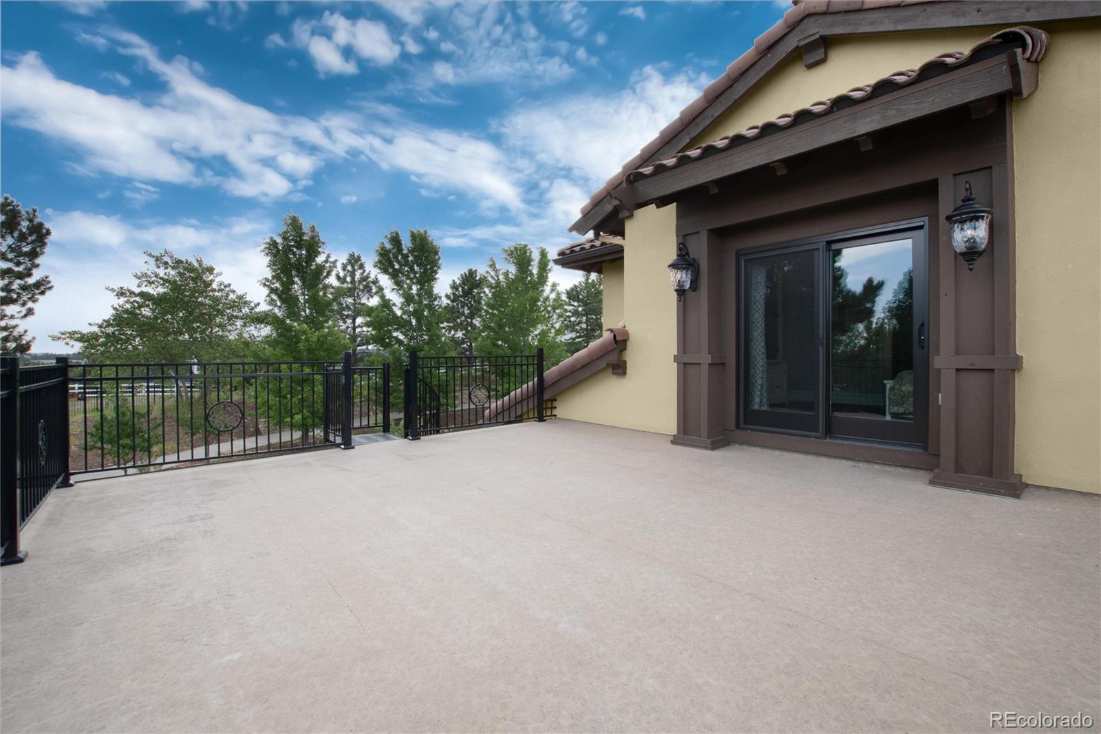 8417 High Ridge Court Castle Pines, CO 80108 - Photo 33 of 48 a view of a house with a roof deck