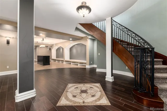 a lobby with furniture and stairs