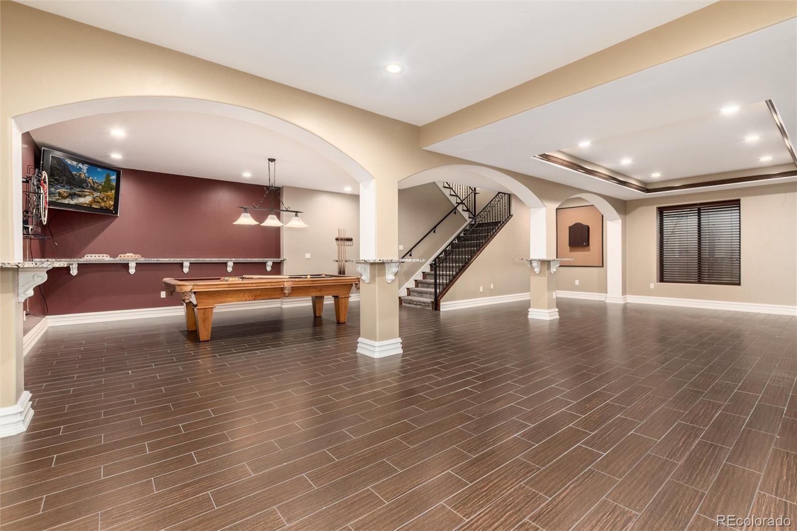 8417 High Ridge Court Castle Pines, CO 80108 - Photo 40 of 48 a lobby with furniture and stairs