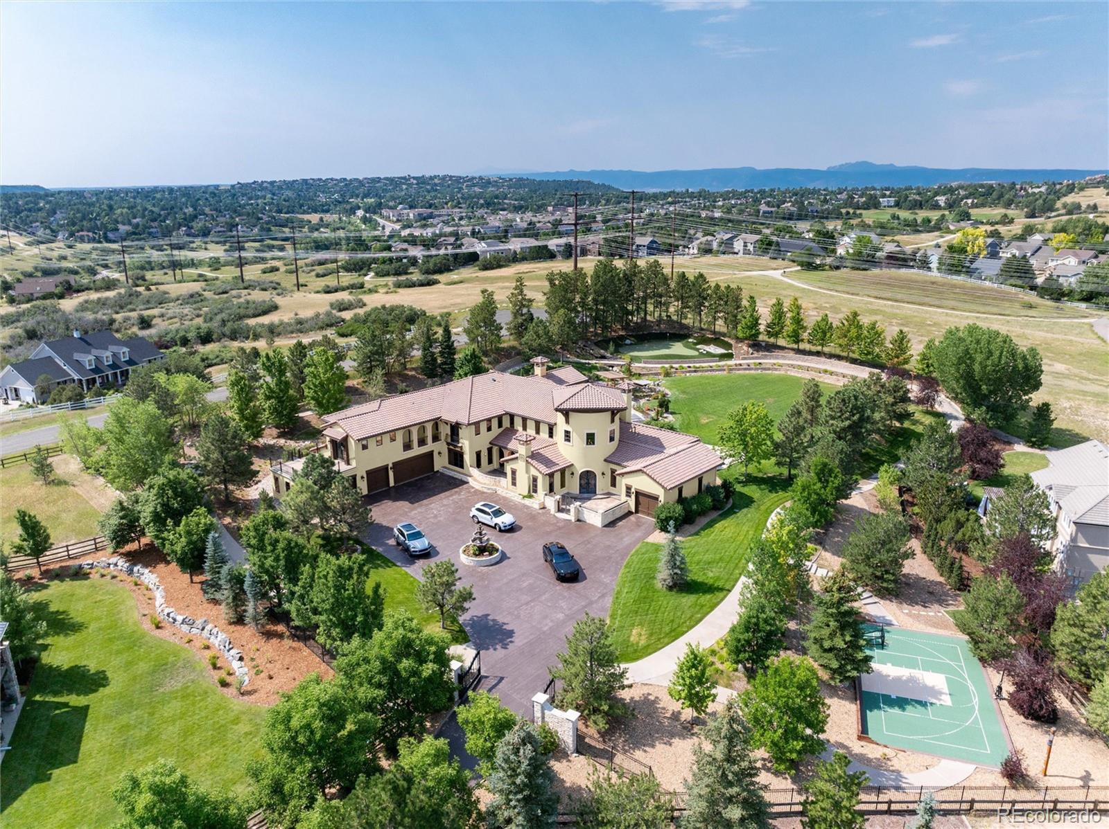 8417 High Ridge Court Castle Pines, CO 80108 - Photo 47 of 48 an aerial view of a house with a lake view