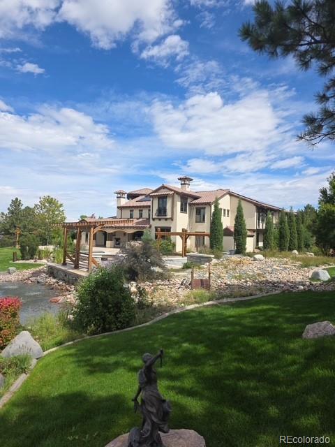 8417 High Ridge Court Castle Pines, CO 80108 - Photo 48 of 48 a view of house with garden