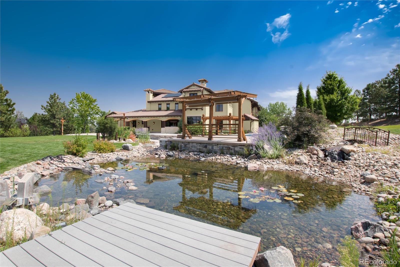 8417 High Ridge Court Castle Pines, CO 80108 - Photo 7 of 48 a view of a house with pool and sitting area