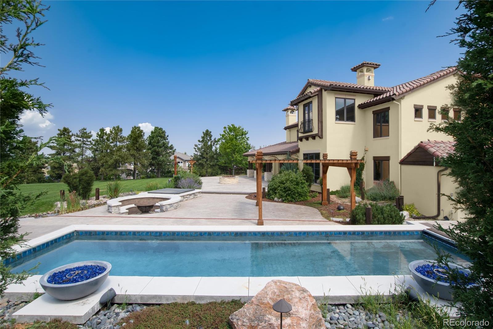 8417 High Ridge Court Castle Pines, CO 80108 - Photo 8 of 48 a front view of a house with porch