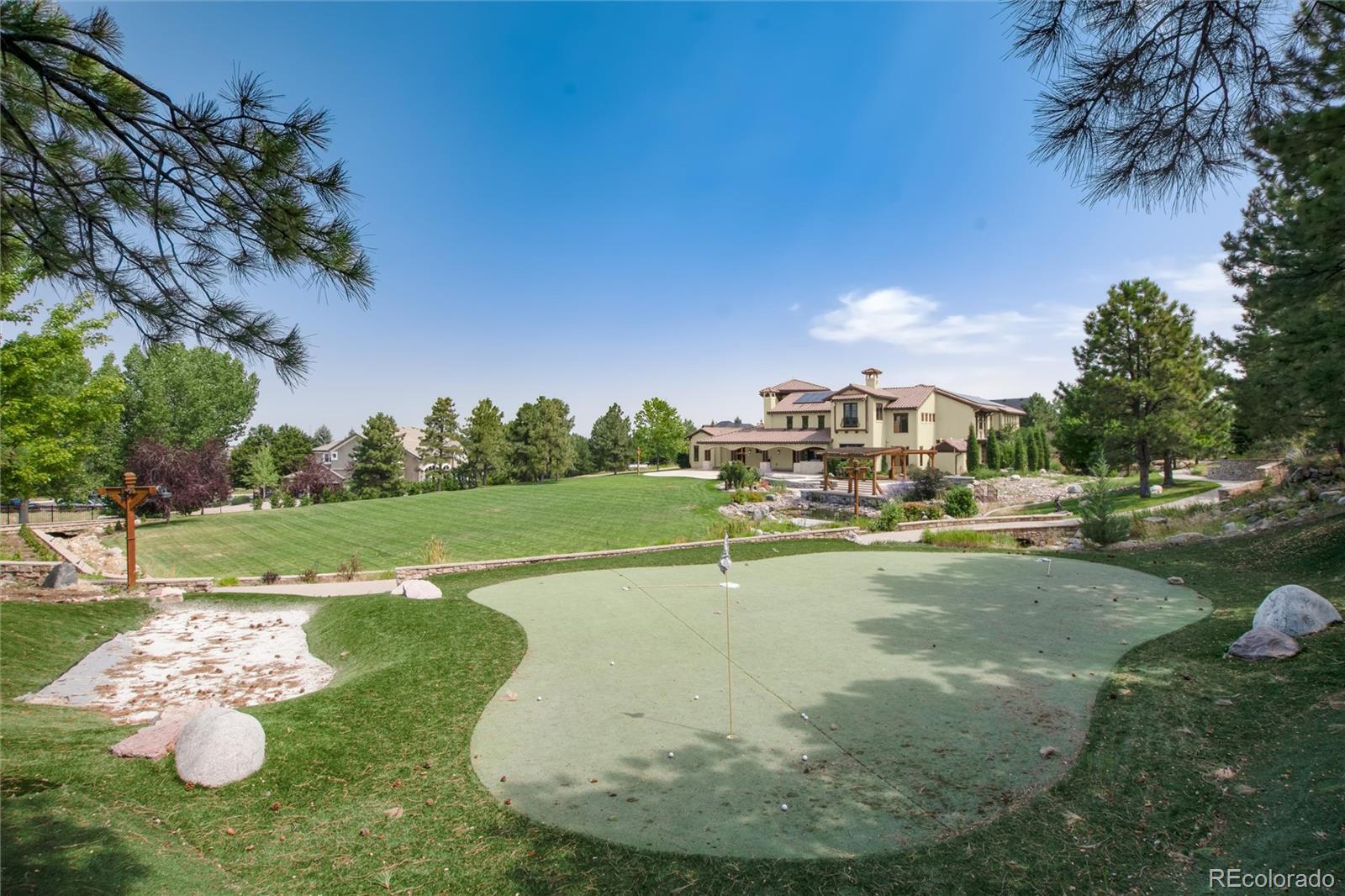 8417 High Ridge Court Castle Pines, CO 80108 - Photo 10 of 48 a view of a swimming pool with a yard
