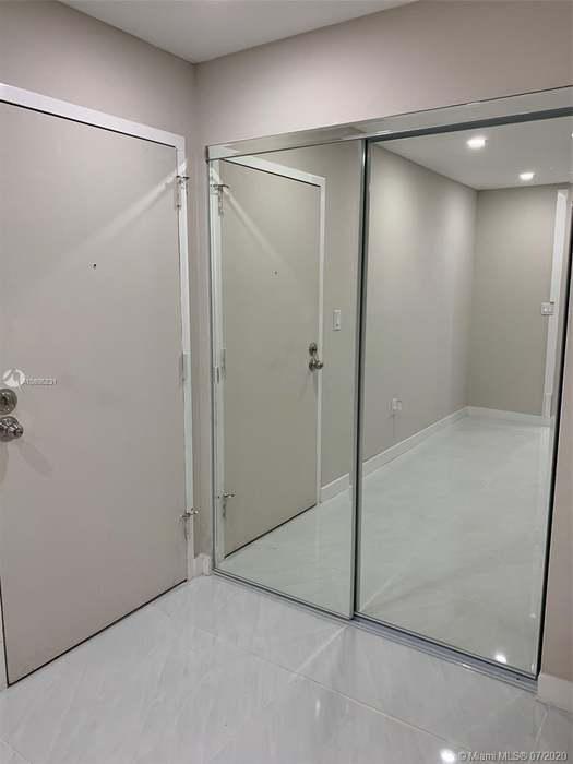4176 Inverrary Drive, Unit 303 Lauderhill, FL 33319 - Photo 12 of 14 a bathroom with a glass shower door