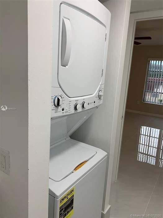 4176 Inverrary Drive, Unit 303 Lauderhill, FL 33319 - Photo 13 of 14 a utility room with dryer and washer