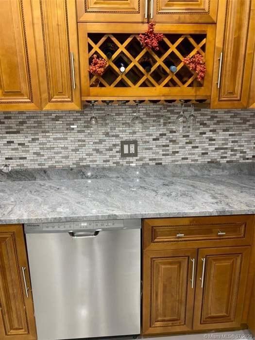 4176 Inverrary Drive, Unit 303 Lauderhill, FL 33319 - Photo 2 of 14 a room with wooden door