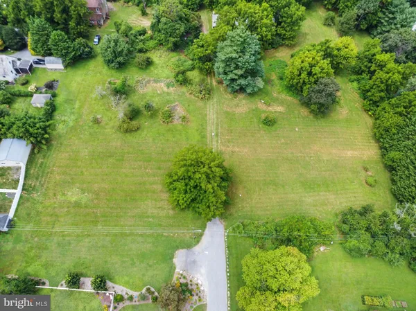 a view of a lake with a yard