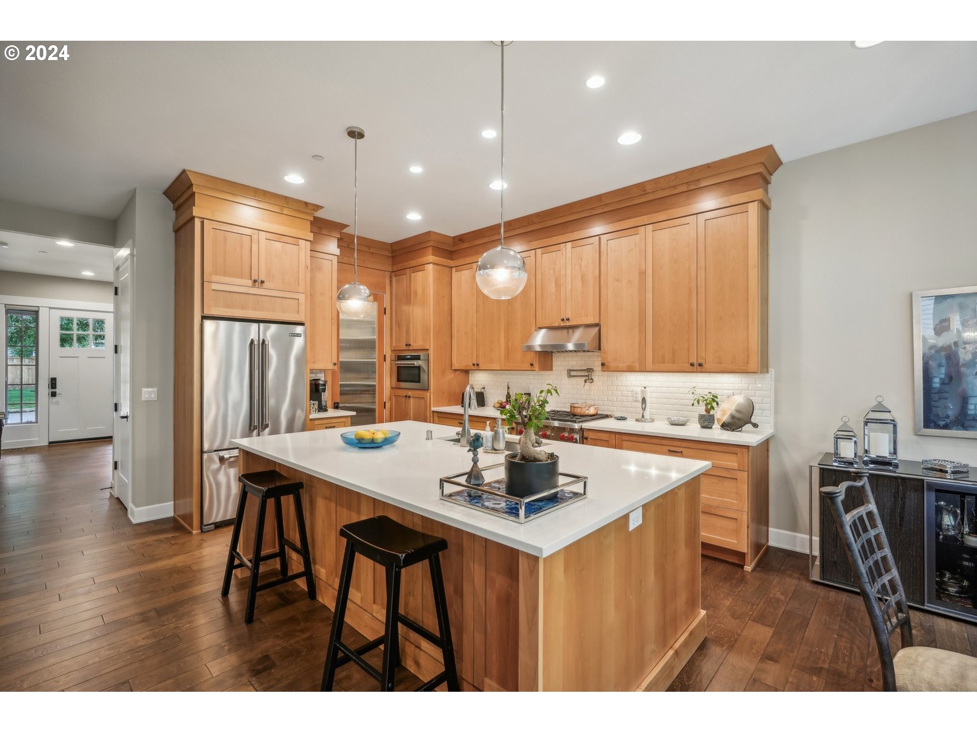 7606 Northwest Payne Street Camas, WA 98607 - Photo 13 of 38 a kitchen with stainless steel appliances kitchen island granite countertop a sink and cabinets