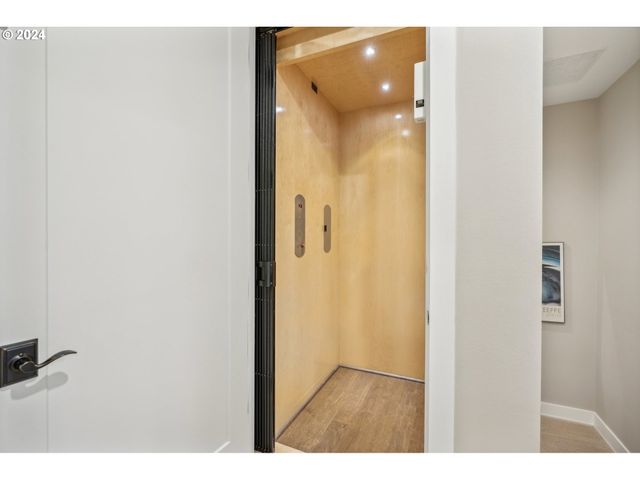 a bathroom with a glass shower door