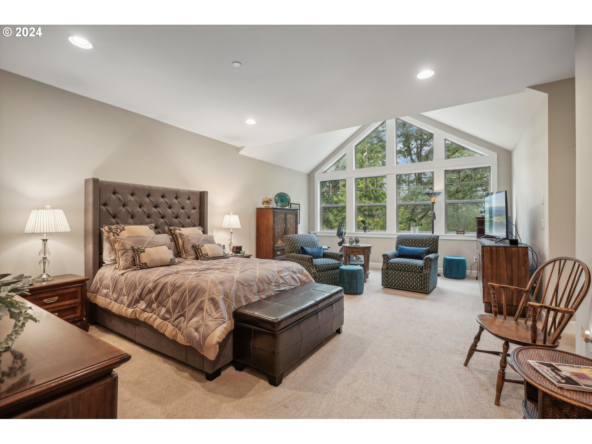 7606 Northwest Payne Street Camas, WA 98607 - Photo 18 of 38 a spacious bedroom with a bed and glass window