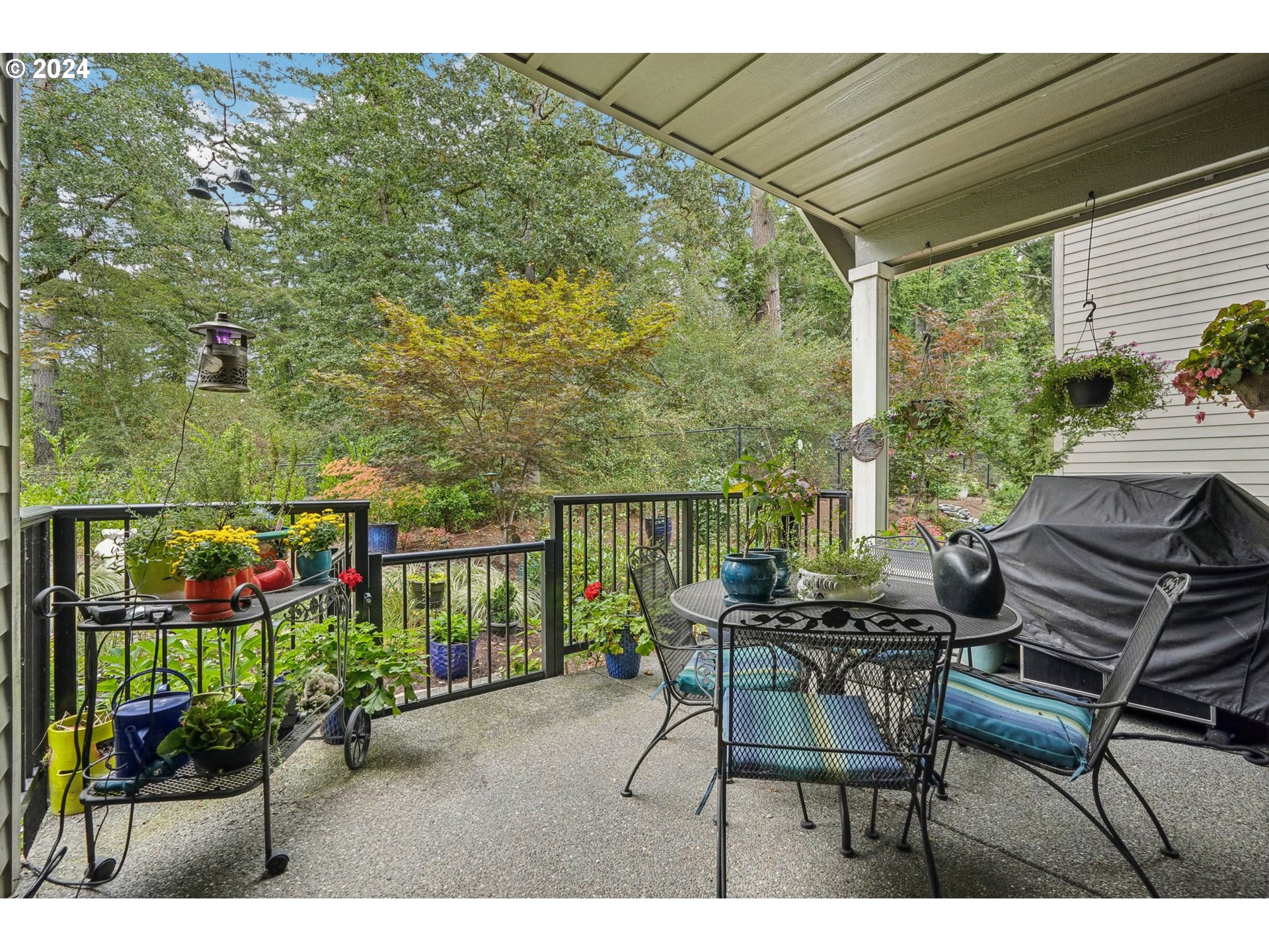 7606 Northwest Payne Street Camas, WA 98607 - Photo 29 of 38 a view of a patio with table and chairs and potted plants