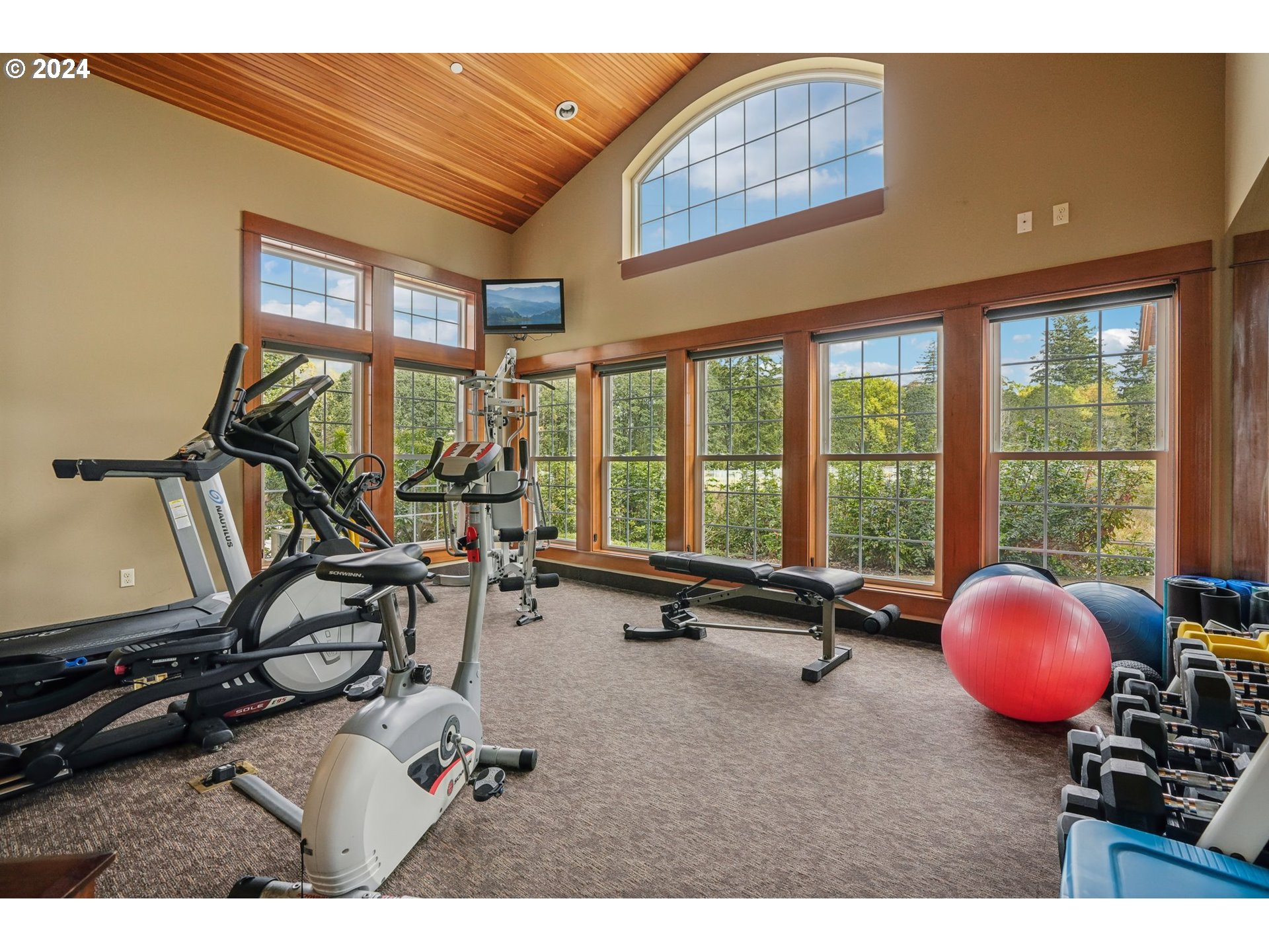 7606 Northwest Payne Street Camas, WA 98607 - Photo 5 of 38 a room with gym equipment and windows
