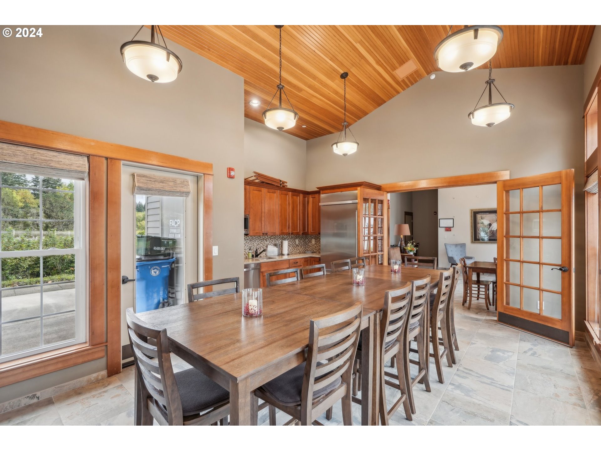 7606 Northwest Payne Street Camas, WA 98607 - Photo 9 of 38 a dining hall with stainless steel appliances a dining table and chairs with wooden floor