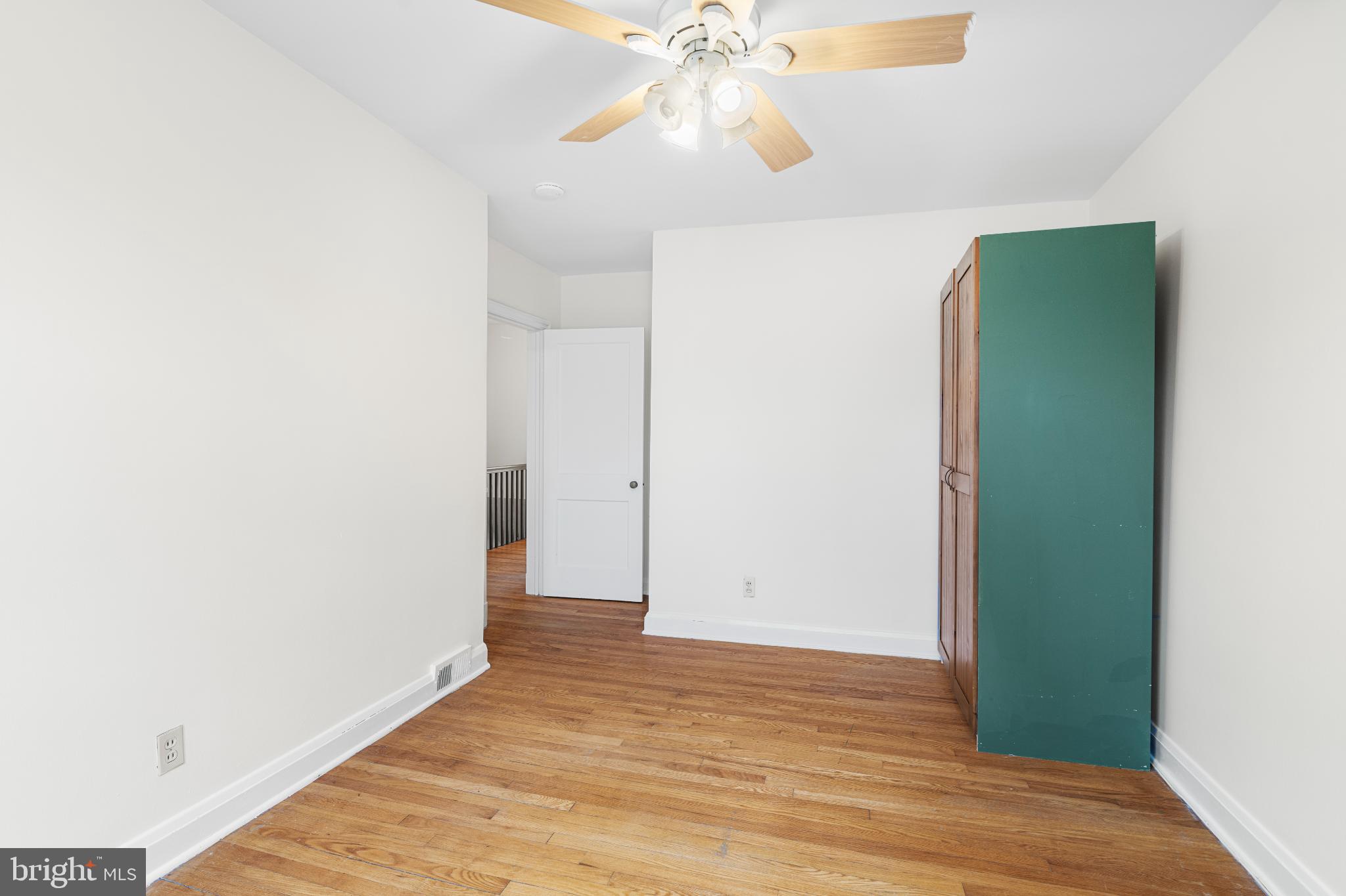 121 Hopkins Road Baltimore, MD 21212 - Photo 14 of 22 Bright and airy room with wooden floors.