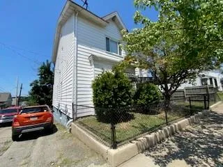 a view of a car parked in front of a house