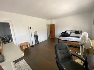 a bedroom with furniture and a fireplace