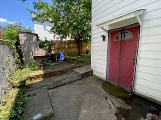 a bed room with a bed and a television