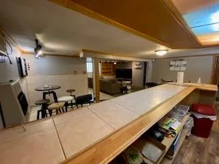 a kitchen with a table and chairs in it