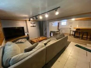 a living room with furniture and a table