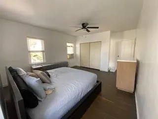 a bedroom with bed and a window