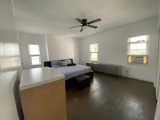 a view of dining room with furniture and wooden floor
