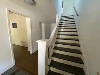 a view of entryway with hallway and stairs