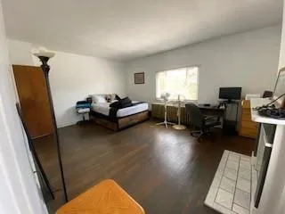 a bedroom with furniture and a bed