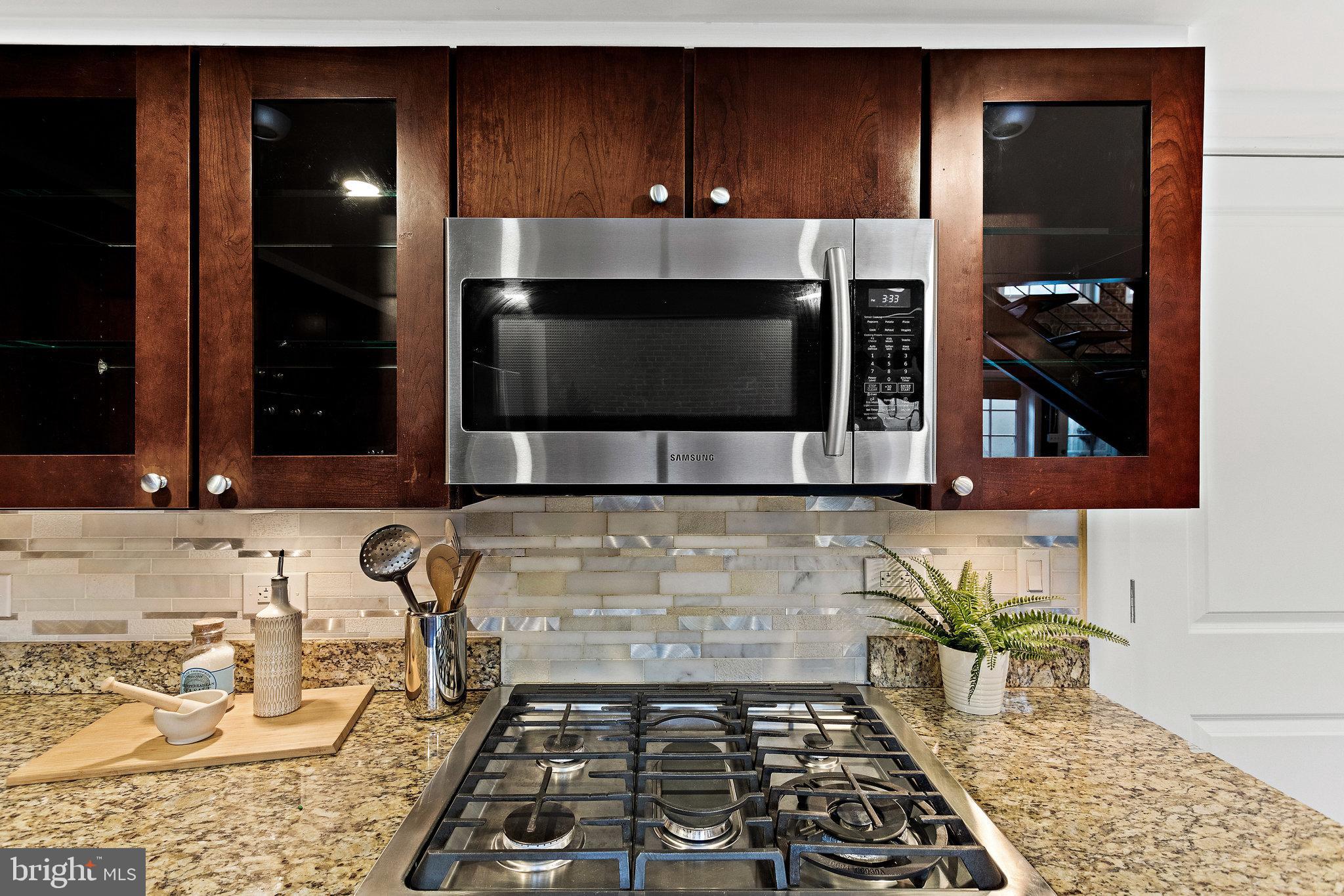 1315 Independence Avenue Southeast, Unit 8 Washington, DC 20003 - Photo 18 of 43 Glass front cabinets flank gas stove
