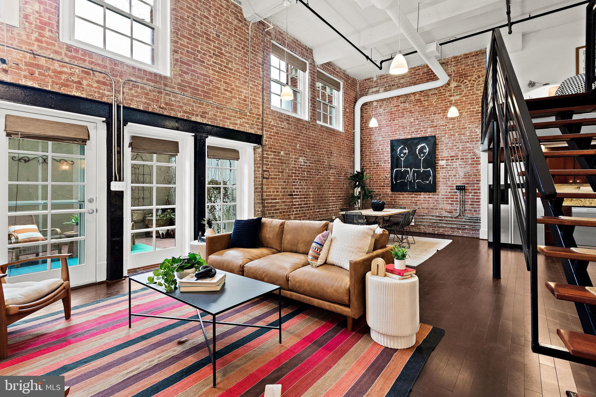 1315 Independence Avenue Southeast, Unit 8 Washington, DC 20003 - Photo 9 of 43 Dramatic 2 story exposed brick living/dining area