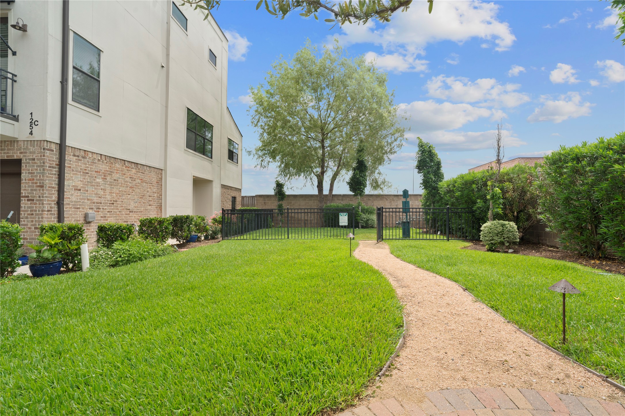 1284 North Post Oak Road, Unit B Houston, TX 77055 - Photo 35 of 37 Lush community pet park for your furry friends to enjoy.