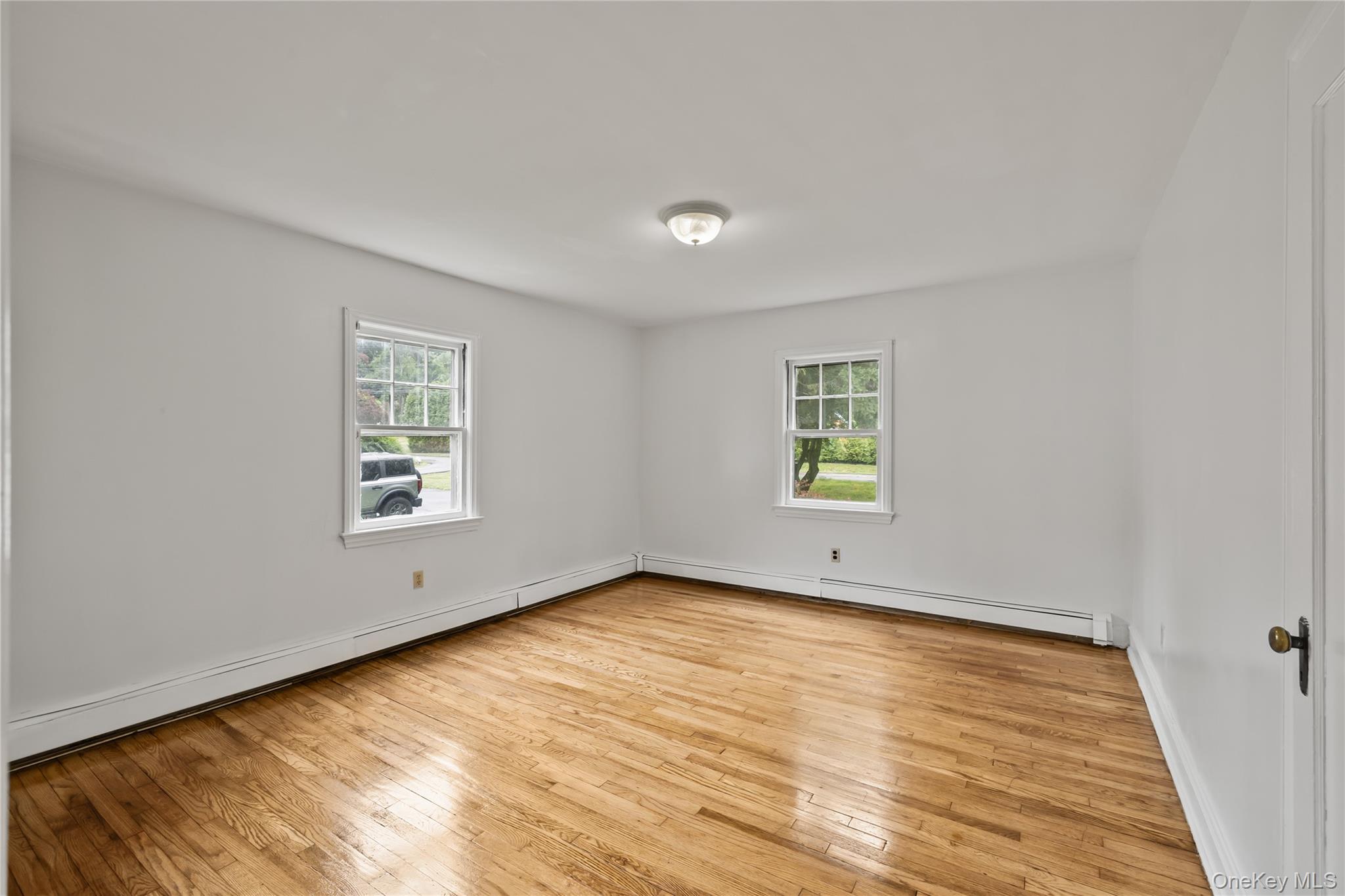 281-283 Old Haverstraw Road Congers, NY 10920 - Photo 14 of 41 wooden floor in an empty room with a window