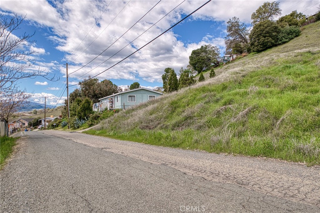 7037 Butte Street Nice, CA 95464 - Photo 16 of 16 a view of a road with a yard