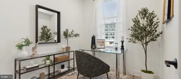 a close view of dining table sitting in kitchen with a potted plant
