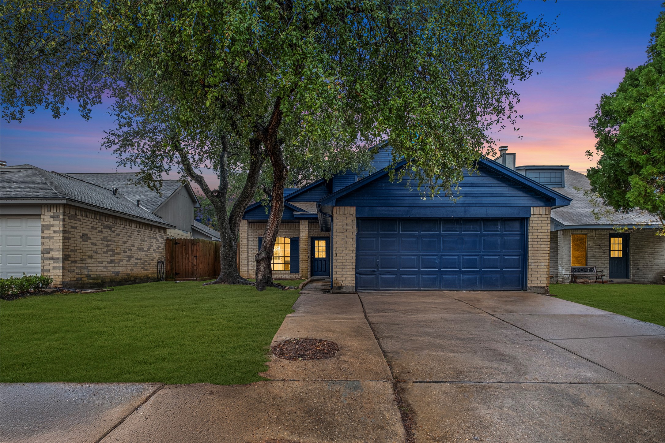 a front view of house with yard and green space