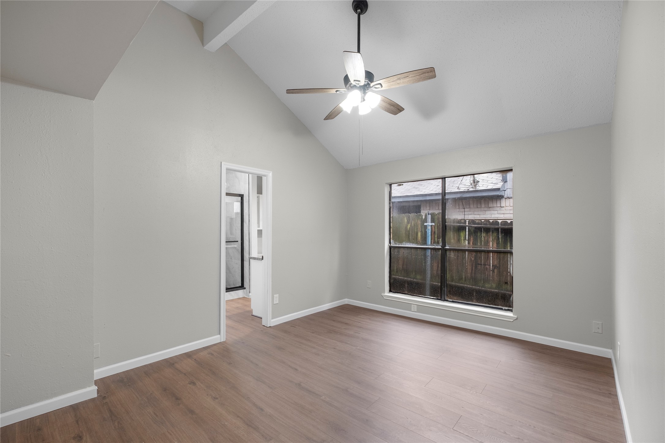 20066 Moonflower Lane Katy, TX 77449 - Photo 13 of 20 wooden floor in an empty room with a window