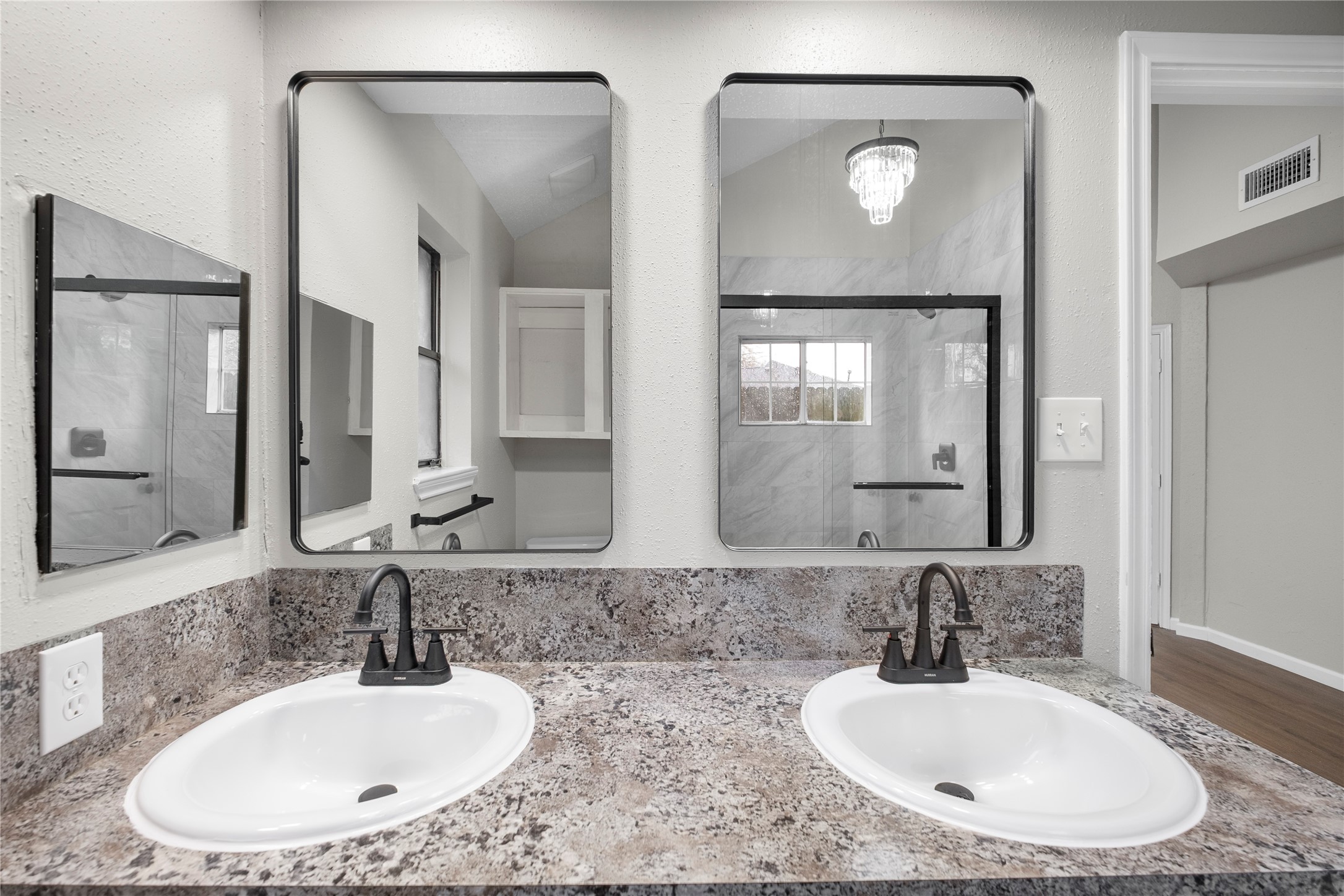 20066 Moonflower Lane Katy, TX 77449 - Photo 15 of 20 a bathroom with double vanity sinks and a mirror