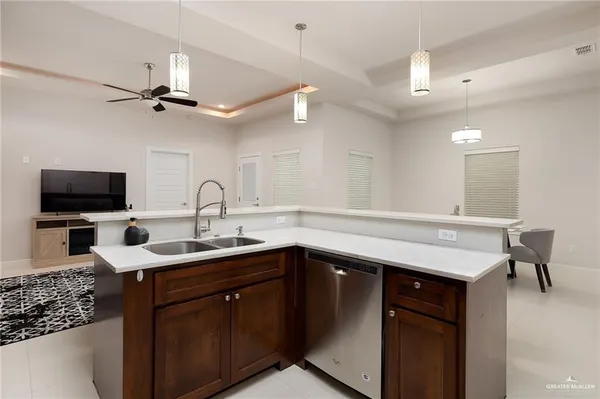 a kitchen with a sink and a refrigerator