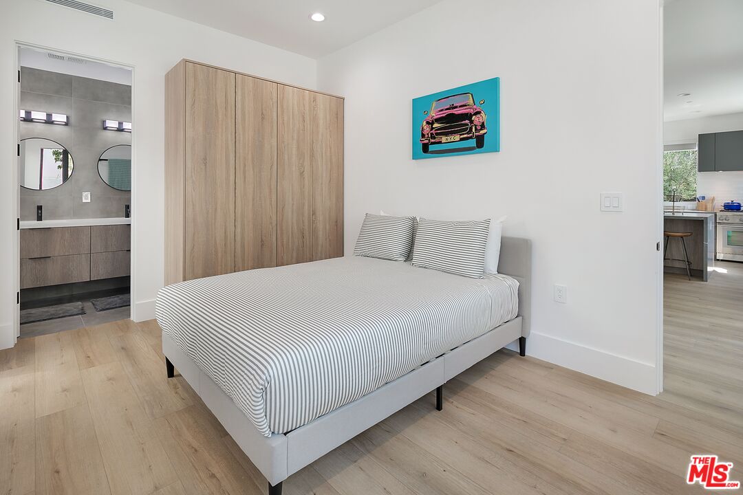 1236 North Spaulding Avenue, Unit 3 West Hollywood, CA 90046 - Photo 11 of 20 a bedroom with a bed and a table