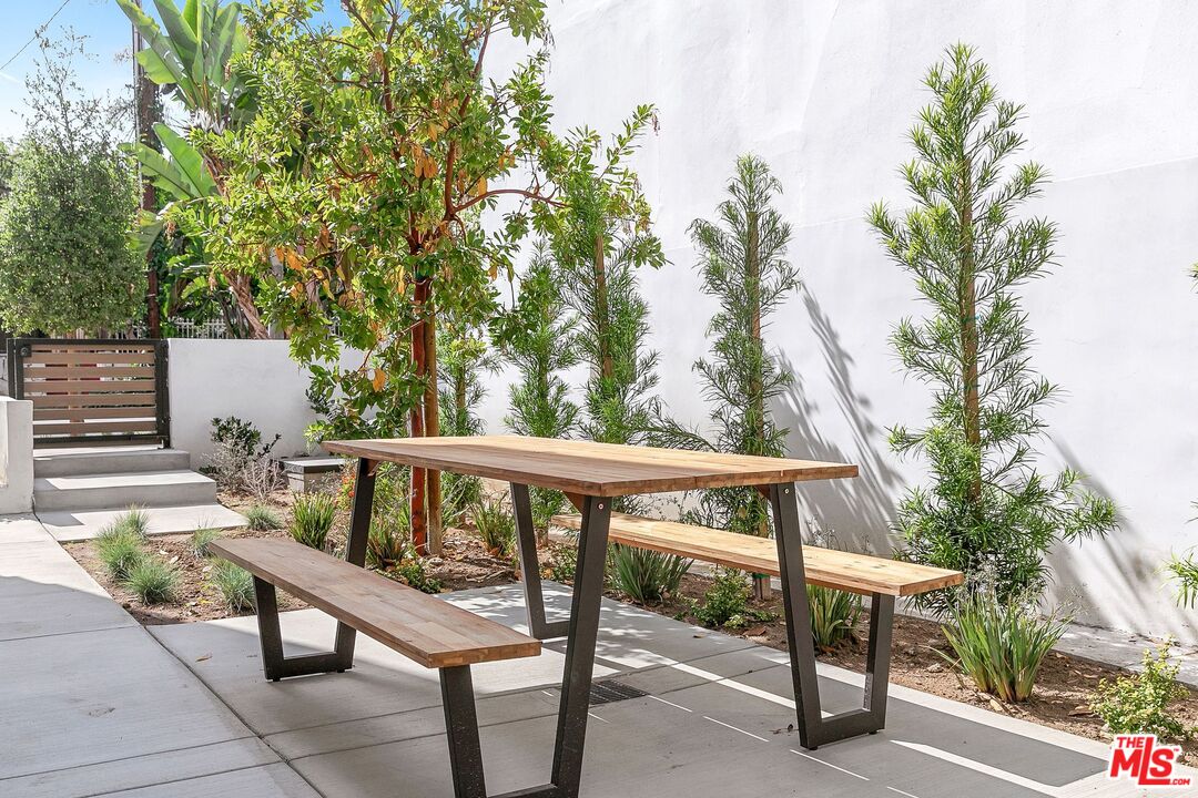 1236 North Spaulding Avenue, Unit 3 West Hollywood, CA 90046 - Photo 12 of 20 a view of a patio with table and chairs and potted plants