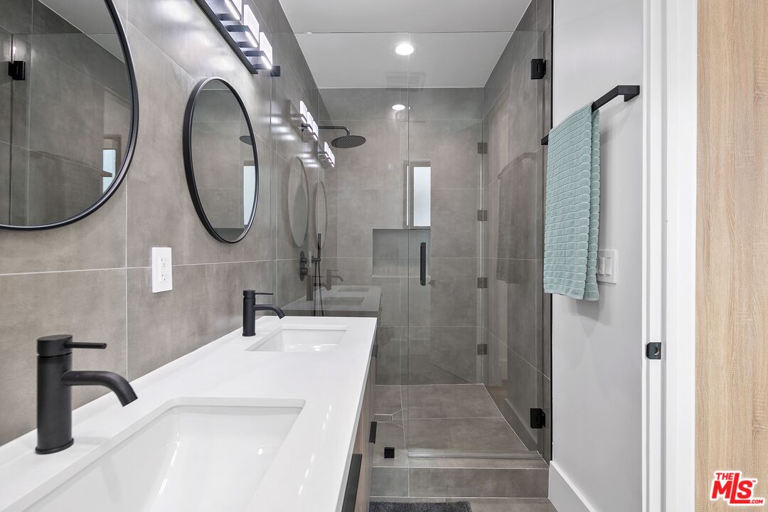 1236 North Spaulding Avenue, Unit 3 West Hollywood, CA 90046 - Photo 14 of 20 a bathroom with a sink a toilet and a mirror