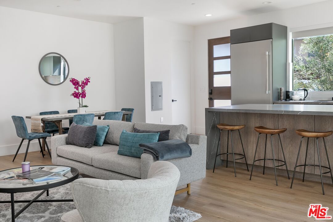 1236 North Spaulding Avenue, Unit 3 West Hollywood, CA 90046 - Photo 3 of 20 a living room with furniture and wooden floor