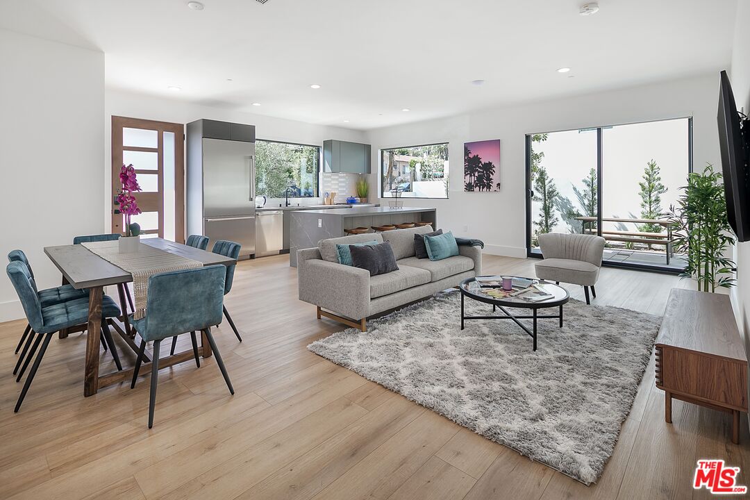 1236 North Spaulding Avenue, Unit 3 West Hollywood, CA 90046 - Photo 4 of 20 a living room with furniture and a wooden floor