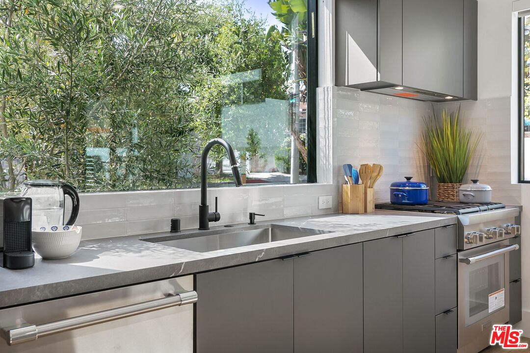 1236 North Spaulding Avenue, Unit 3 West Hollywood, CA 90046 - Photo 5 of 20 a kitchen with a sink and a refrigerator